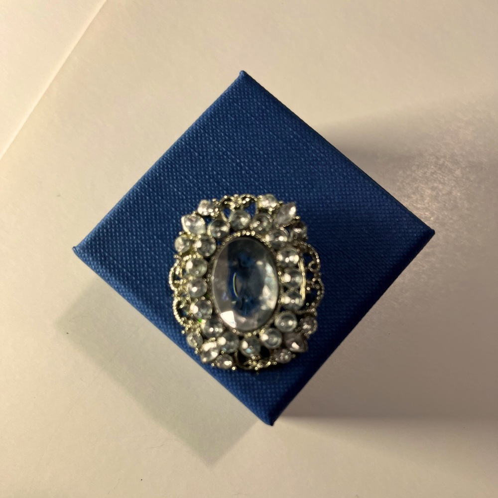 Vintage Brooch silver with faux diamond accents. 1 1/2” long by 1” wide.